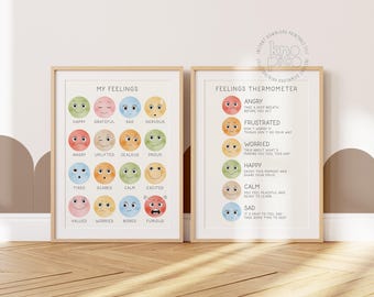 May include: Two framed prints with light wood frames. The left print says "MY FEELINGS" and features colorful emoji faces representing different emotions. The right print is a "FEELINGS THERMOMETER" with descriptions for each emotion.