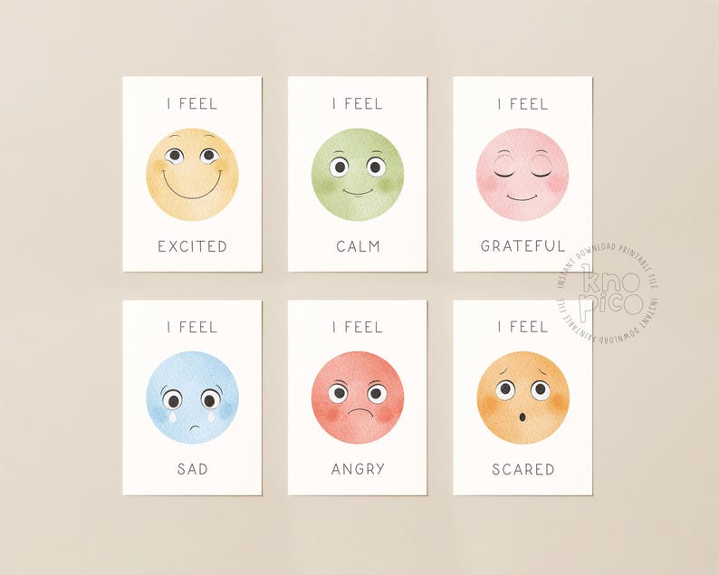 May include: Six emotion cards with watercolor illustrations. Each card features a different colored circle with a corresponding facial expression and the words "I FEEL" above. The emotions include excited, calm, grateful, sad, angry, and scared.