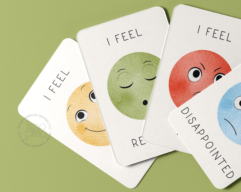 May include: A collection of emotion cards with watercolor illustrations. Each card features a different emotion, such as happy, relaxed, and disappointed, represented by a colorful face and the words "I FEEL" or the emotion's name.