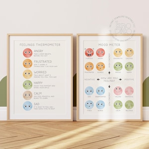 Op de afbeelding: Twee ingelijste prints met een lichte houten afwerking. De linkerprint is een "Gevoelsthermometer" met illustraties van emoties als boos, blij en verdrietig. De rechterprint is een "Stemmingmeter" met emoties van woedend tot ontspannen.