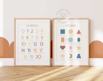 May include: Two framed educational prints. One displays numbers 0-20 in various colours, titled "LOS NÚMEROS." The other, titled "LAS FORMAS," showcases colourful geometric shapes with Spanish labels. Both are in wooden frames.