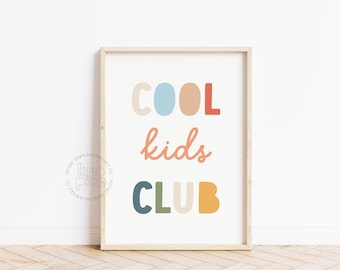 May include: A framed wall art print featuring the text COOL kids CLUB in various colors including light blue, peach, red, dark blue, olive green, and yellow. The word COOL is in block letters, kids is in cursive, and CLUB is in block letters.