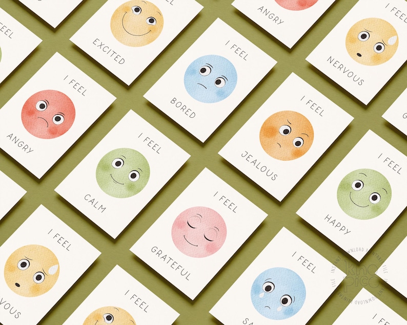 May include: Cards with watercolor illustrations of faces expressing emotions like angry, happy, and sad. Each card has the phrase "I FEEL" above the emotion. The cards are on a green background.