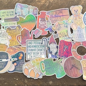 May include: A selection of vibrant stickers with diverse designs and text. The stickers include illustrations of a teddy bear, a gnome, a heart, and phrases such as "I was sleeping like the dead" and "Take your chances while you're young."
