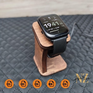 May include: A wooden charging stand for a smartwatch. The stand is brown and has a curved design. The smartwatch is black and has a digital display showing the time, date, and battery life. The display shows "19:41" and "07:58 16:09". The stand is on a black surface. The image includes icons for CDR, SVG, DXF, AI, and PDF file formats.