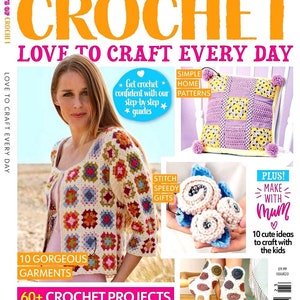 May include: A magazine cover for "100 Days of Crochet" issue 23, featuring a woman wearing a crocheted cardigan, a crocheted pillow, and a crocheted flower bouquet. The cover text reads "Love to Craft Every Day" and "60+ Crochet Projects".