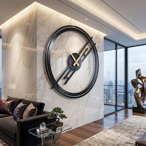 May include: A large, modern black wall clock with gold-colored hands and a minimalist design. The clock is mounted on a marble wall in a contemporary living space. The clock's diameter is approximately 36 inches.