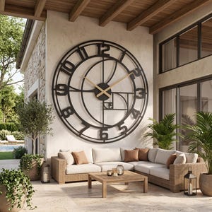 May include: A large, circular, black metal wall clock featuring a skeleton design with a golden ratio spiral pattern, bold black numerals from one to twelve, and thin, light-coloured hands mounted on a central black circular hub.