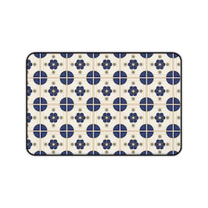 May include: Rectangular mousepad featuring a repeating pattern of navy blue circles, floral designs, and star shapes on an off-white background. Gold lines create a grid pattern. The mousepad has a black border.