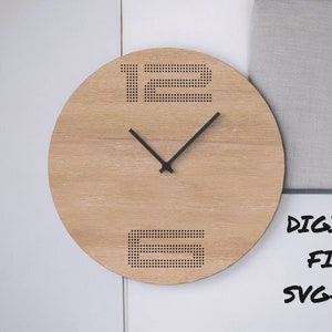 May include: A round wooden wall clock with black hands and numbers. The numbers 12 and 6 are represented by dotted patterns. The clock is mounted on a white wall. The text "DIGITAL FILE SVG-DXF" is visible.
