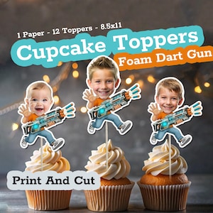 May include: Cupcake toppers featuring images of children with foam dart guns. The toppers are on top of cupcakes with white frosting. The text on the image says "Cupcake Toppers Foam Dart Gun" and "Print And Cut".