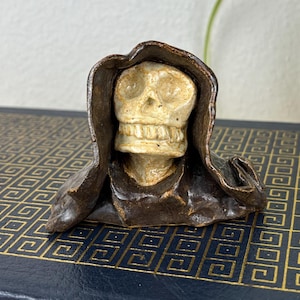 May include: A rustic wooden sign with the text "Welcome to our home" in white lettering. The sign features a distressed finish and a simple, inviting design, perfect for entryway decor.