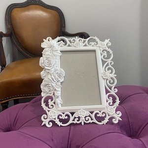 Ornate white carved wood picture frame