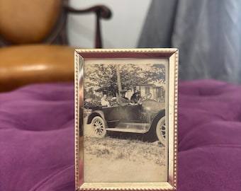 Vintage black and white car photo in vintage frame