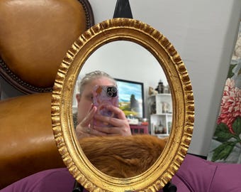 Vintage gilded wood mirror with red felt