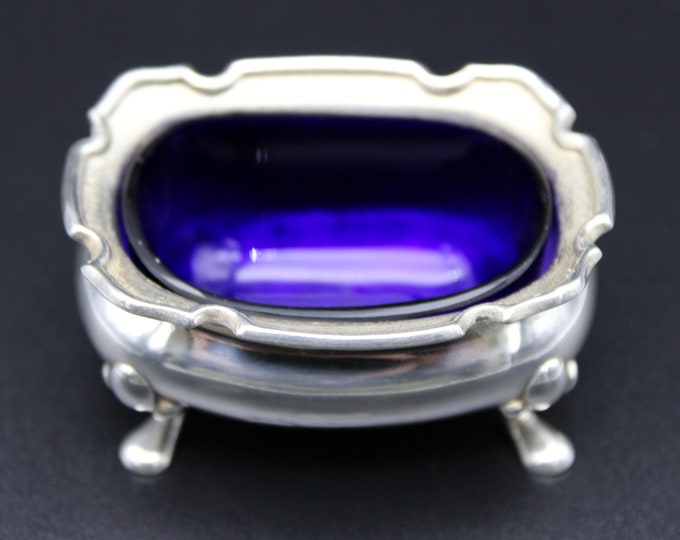 A Sterling Silver Open Table Salt With Blue Glass Liner