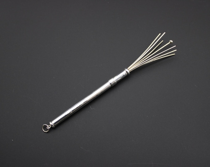 A Sterling Silver Retractible Cocktail Swizzle Stick