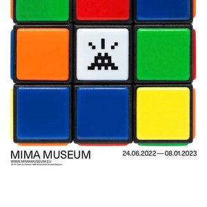 May include: A colourful Rubik's Cube with a pixelated space invader graphic on one side. The cube is displayed against a white background with the text "MIMA MUSEUM" and "INVADER RUBIKCUBIST" in black. The text "24.06.2022 - 08.01.2023" and "Exhibition" are also displayed in black.