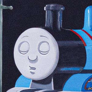 May include: A blue steam locomotive toy with a white face featuring closed eyes and a small mouth. The engine has a black smokestack, red stripes on its side, and a light blue cab. A tall, thin, pale green utility pole stands to the left.