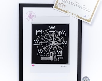May include: A black and white print of a Ferris wheel with crowns drawn on it. The print is framed in black and has a white mat. The print is signed "Banksy" in the bottom right corner.