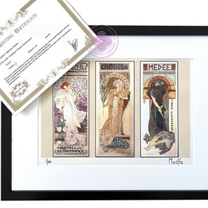 May include: A framed triptych print featuring three Alphonse Mucha posters titled Gismonda, Medee, and La Dame aux Camelias, displayed in a black frame with a white mat. An editing certificate with gold borders is placed on top of the framed artwork.