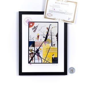 May include: A framed print of a colorful abstract painting by artist,  "Kandinsky". The painting features geometric shapes, lines, and circles in shades of red, yellow, blue, black, and white. The print is framed in black and includes a certificate of authenticity.