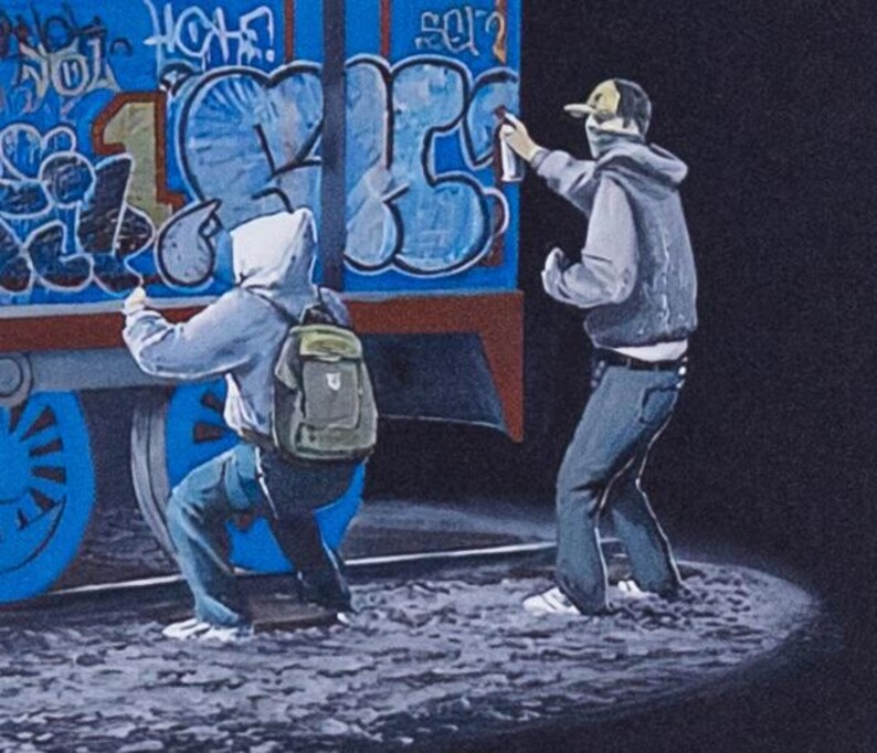 May include: A painting depicting two figures in hoodies and jeans applying graffiti to the side of a blue train car. One figure crouches while wearing a backpack, and the other stands while using a spray paint can. The train features blue wheels and large, stylized blue and black lettering against a dark background.