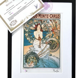 May include: A vintage poster for Monaco Monte Carlo, featuring a woman in a flowing white dress surrounded by colourful flowers and foliage. The poster is in the Art Nouveau style and features the artist's signature, "Mucha", in the bottom right corner.