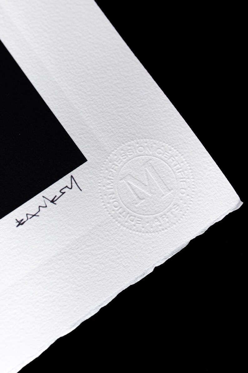 May include: A white textured paper print with a black rectangular area. The paper features a hand-signed signature in black ink and a circular embossed stamp that reads "EDITION IMPRESSION CERTIFIEE" with a large letter M in the center.
