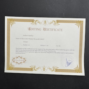 May include: A white rectangular editing certificate with a gold decorative border. The text reads Editing Certificate, Author: Banksy, Name of the work: Winnie the pooh (2003), Number: 10, Edition/1: 150, Size: B4, and includes a blue ink signature stamp.