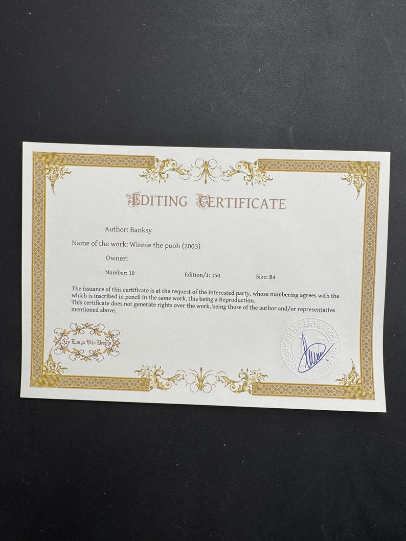 May include: A white rectangular editing certificate with a gold decorative border. The text reads Editing Certificate, Author: Banksy, Name of the work: Winnie the pooh (2003), Number: 10, Edition/1: 150, Size: B4, and includes a blue ink signature stamp.
