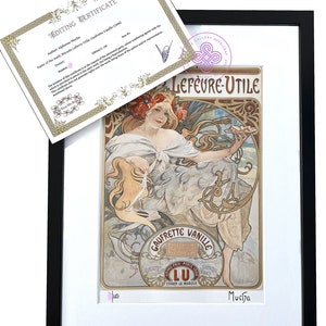 May include: A framed art print titled Biscuits Lefèvre-Utile: Gaufrette Vanille by Alphonse Mucha, featuring a woman with red flowers in her hair holding a plate of biscuits. Includes an editing certificate with the text Edition 1/150.