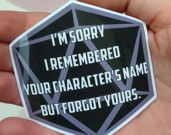 May include: A black and purple D20 dice sticker with the text "I'm sorry I remembered your character's name but forgot yours."