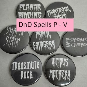 May include: Seven black and white button pins with a metal backing. Each pin features a different Dungeons and Dragons spell name in a gothic font. The spell names are Planar Binding, Phantasmal Force, Primal Savagery, Psychic Scream, Transmute Rock, Vicious Mockery, and Static.