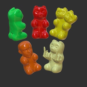 May include: A collection of six gummy bear figurines in various colors, including green, red, yellow, and orange. The figurines are all in different poses, some with arms raised and some with hands on their hips.