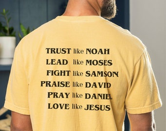 May include: A yellow t-shirt with black text that reads "TRUST like NOAH, LEAD like MOSES, FIGHT like SAMSON, PRAISE like DAVID, PRAY like DANIEL, LOVE like JESUS".