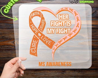 May include: A DTF transfer featuring an orange ribbon and heart design with the text "Her Fight Is My Fight" and "MS Awareness." The ribbon includes words like "Faith," "Hope," and "Love." The design is on a clear background.