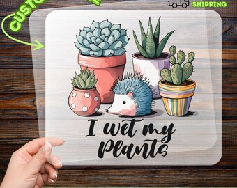 May include: A DTF transfer featuring a collection of potted succulents and a hedgehog illustration. The text "I wet my plants" is displayed below the image. The design includes a cactus, aloe, and other plants.