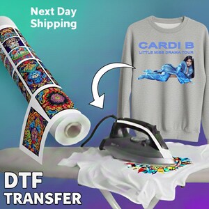 The image is an advertisement for a DTF (Digital Transfer) transfer service, featuring a gray sweatshirt with a design and a roll of DTF paper.