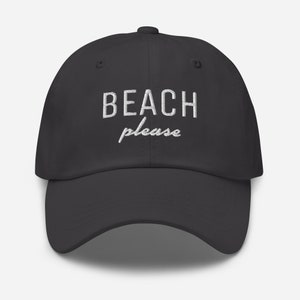 May include: A dark gray baseball cap with white embroidered text that reads "BEACH please".