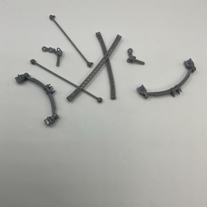 May include: A set of gray plastic model train parts, including curved tracks, straight tracks, and connecting rods.