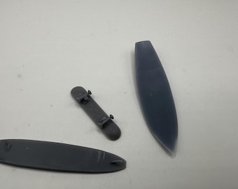 1/25 scale surf and turf special. Two surfboards and one skateboard. 3-D printed.