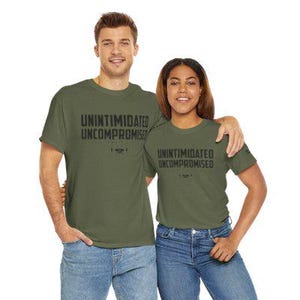 May include: Two people wearing matching green t-shirts with the text "Unintimidated Uncompromised" printed on them.
