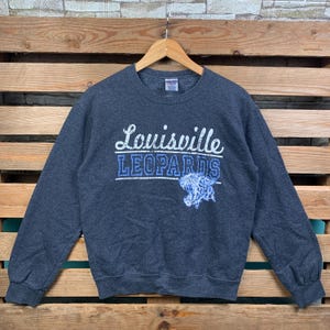 Bluza Vintage Louisville Leopards Sweter z okrągłym dekoltem Louisville Leopards Sweter Louisville Leopards Graficzne logo Louisville Leopards