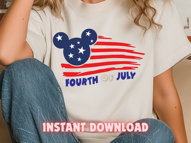 May include: White t-shirt with a red, white, and blue American flag design featuring a Mickey Mouse silhouette. The text "Fourth of July" is printed below the flag.