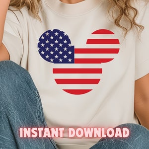 May include: A white t-shirt with a red, white, and blue Mickey Mouse head design. The design is in the shape of the American flag. The text "INSTANT DOWNLOAD" is printed on the bottom of the shirt.