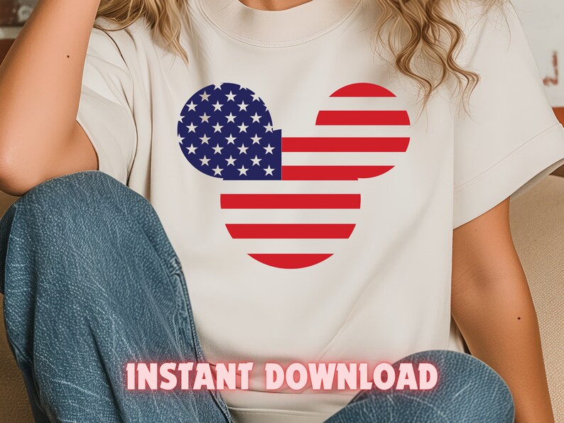 May include: A white t-shirt with a red, white, and blue Mickey Mouse head design. The design is in the shape of the American flag. The text "INSTANT DOWNLOAD" is printed on the bottom of the shirt.