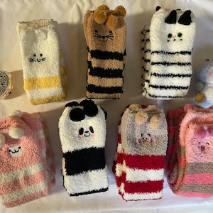 Super long, warm, fuzzy, cozy Macron socks! The soft, fuzzy socks add to the warmth and comfort.