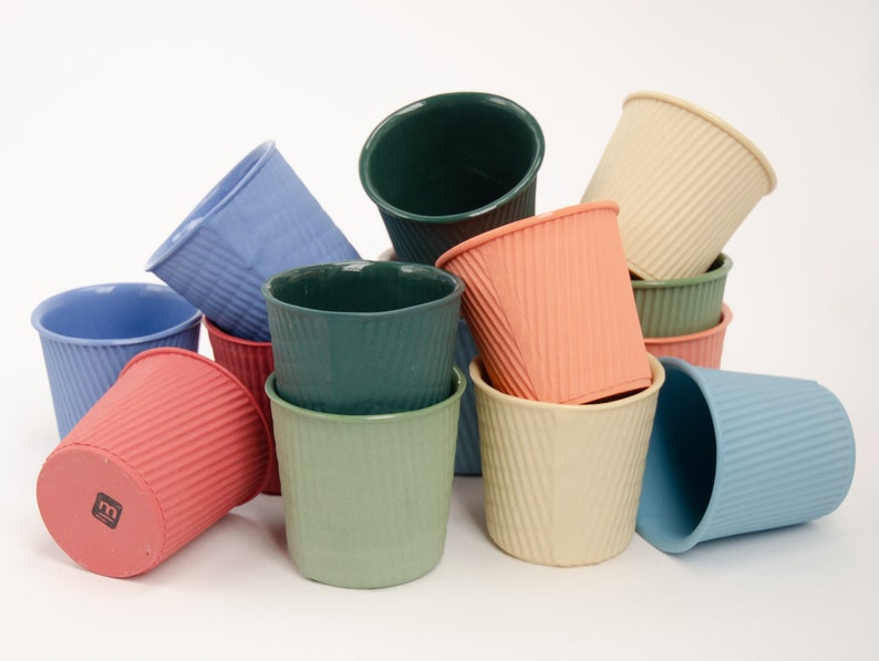 Colorful porcelain espresso cup with a matte unglazed exterior and high gloss inside