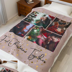 May include: A personalized blanket with a light brown background and gold stars. The blanket features five photo collages of people celebrating Christmas. The words "First Christmas Together" are written in cursive.